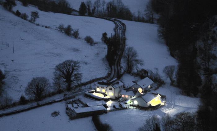 Photograph taken from the top of our nearest hill of Madogs Wells In the snow and fully occupied.